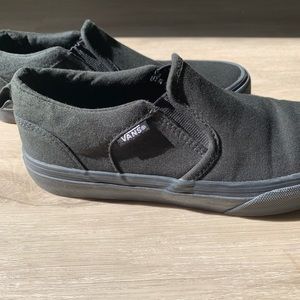 All black vans slip on sneakers